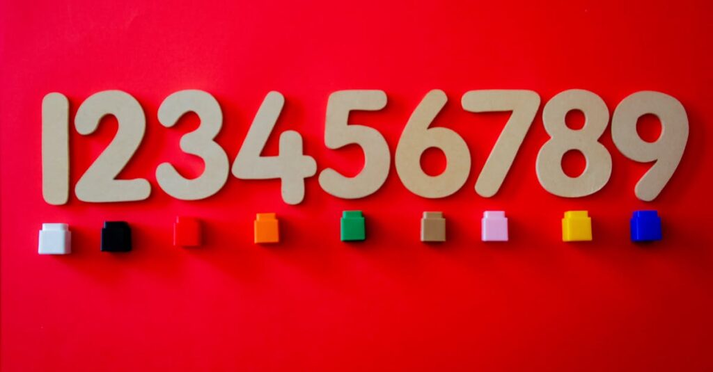 pexels-photo-1329295-1329295 Wooden numbers with colorful cubes on a vibrant red background.