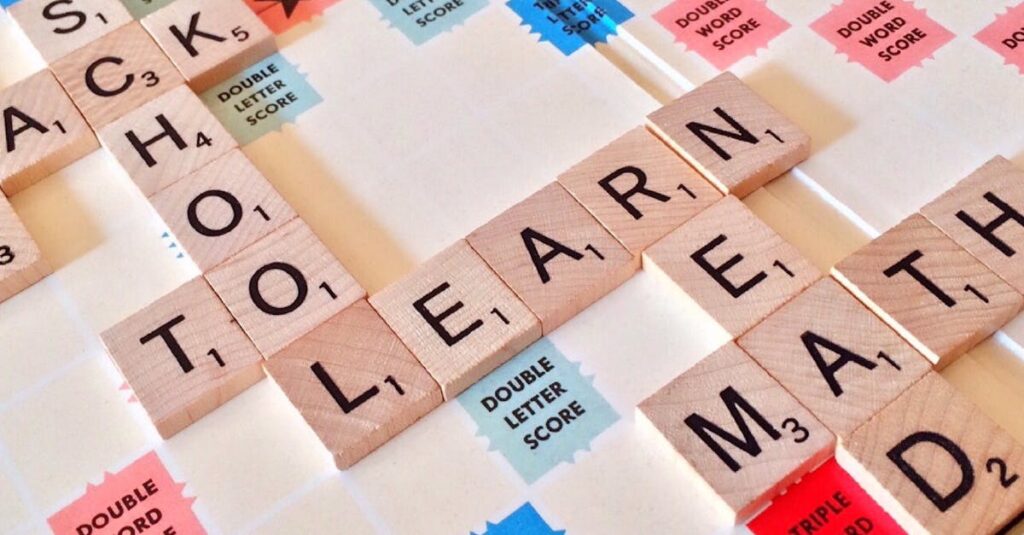 pexels-photo-256417-256417 Close-up of Scrabble tiles forming words related to education and school.